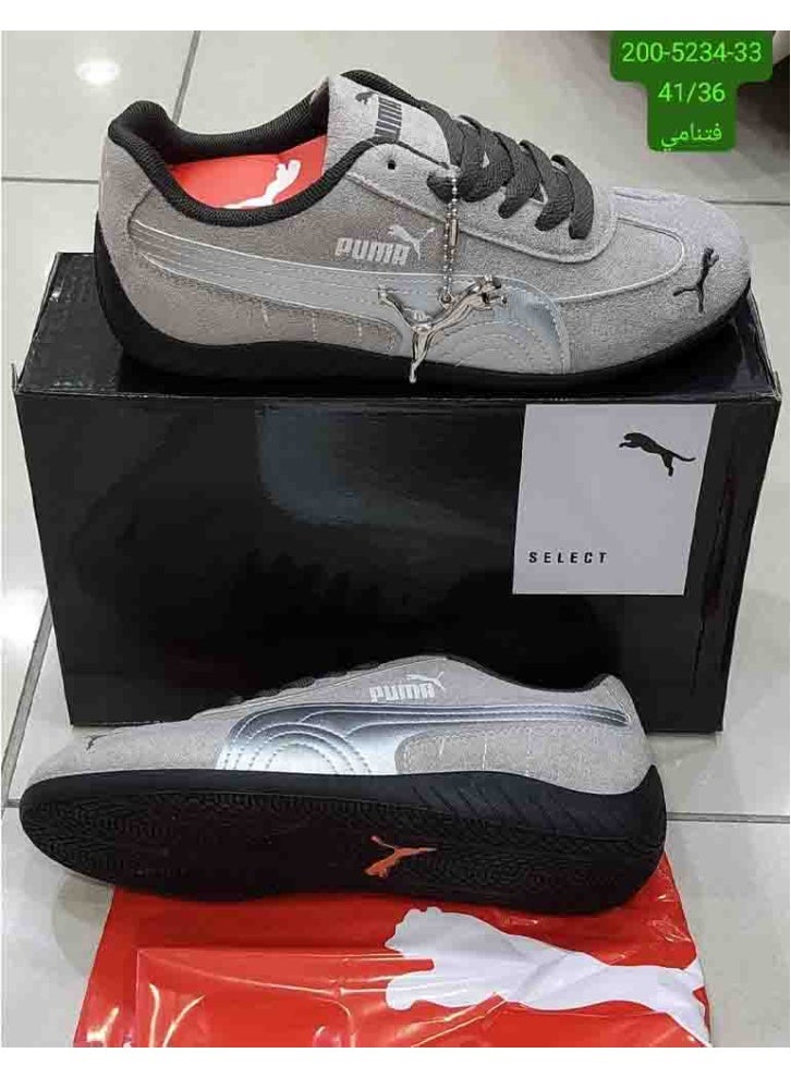 The shoe is a Puma Speed ​​Cat